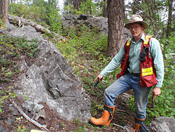 Prospector Cameron Barker exploring for porphyry copper mineralization associated with alkaline intrusive rocks in the Quesnel Trough of British Columbia